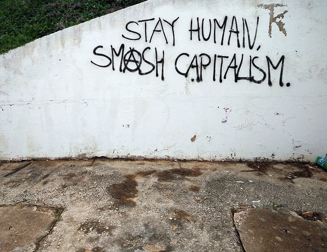 Ada Wanders/Włóczykijada. Writing on the wall in Lagos: Stay Human. Smash Capitalism.